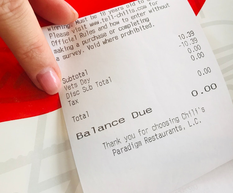 A receipt with $0.00 due because of a Veteran's Day discount applied to the total.