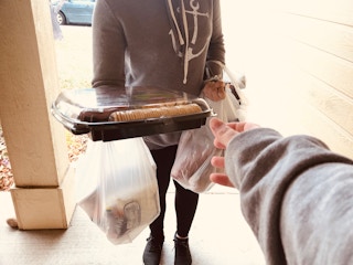 A person delivering groceries