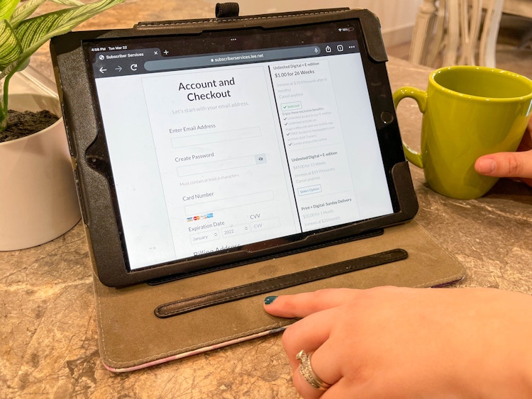 tablet with digital newspaper subscriptions
