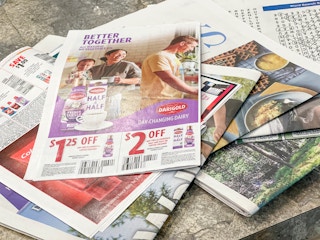 sunday newspaper laid out on table