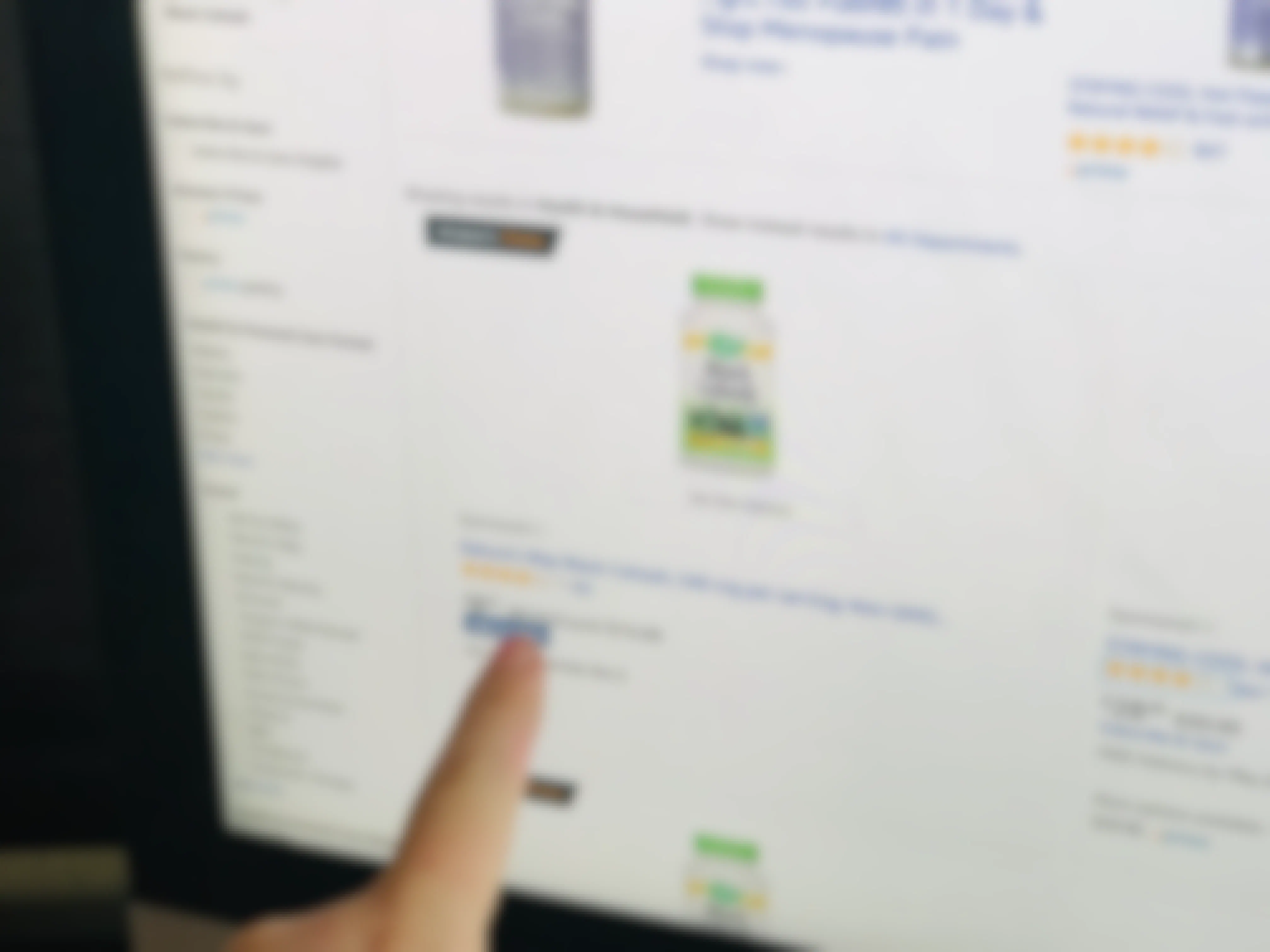 A person pointing out "add-on item" on an amazon webpage screen.