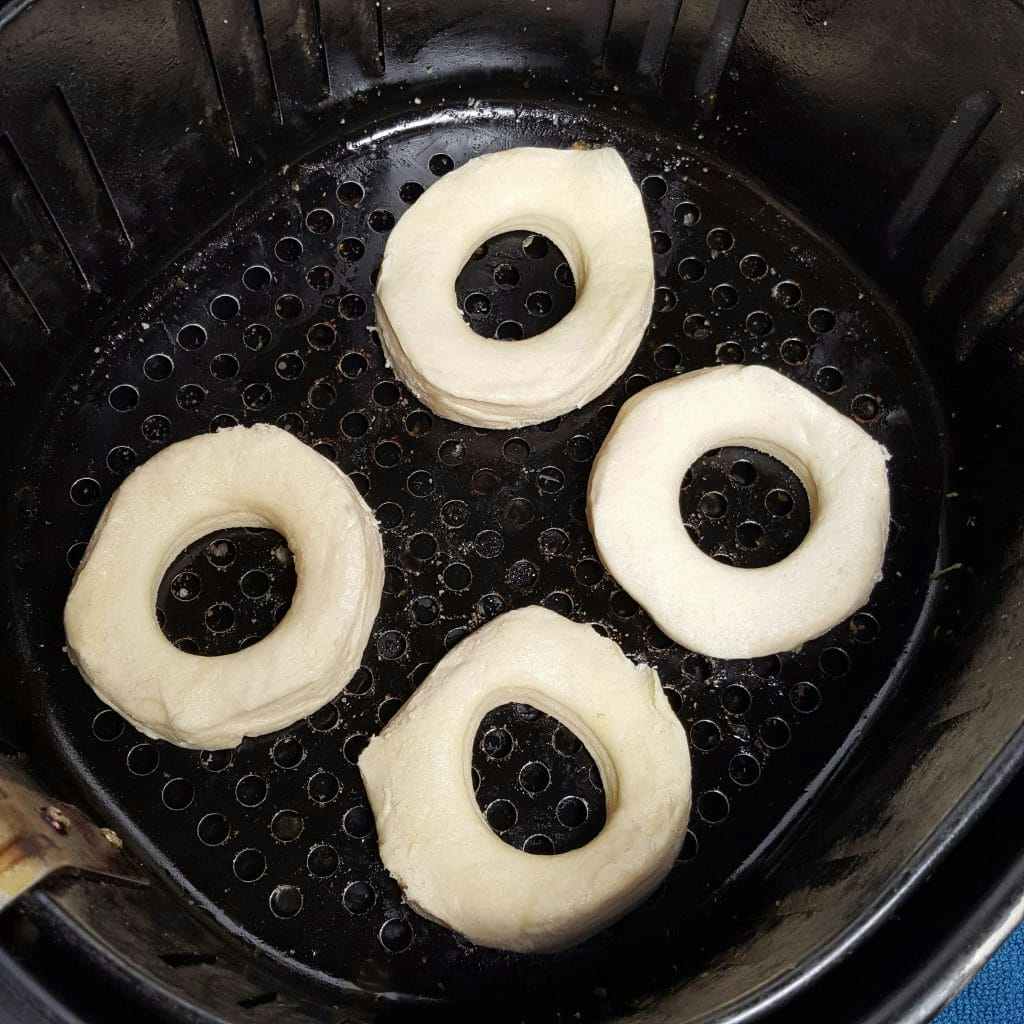 Biscuit dough with holes in the middle to make air fryer donuts