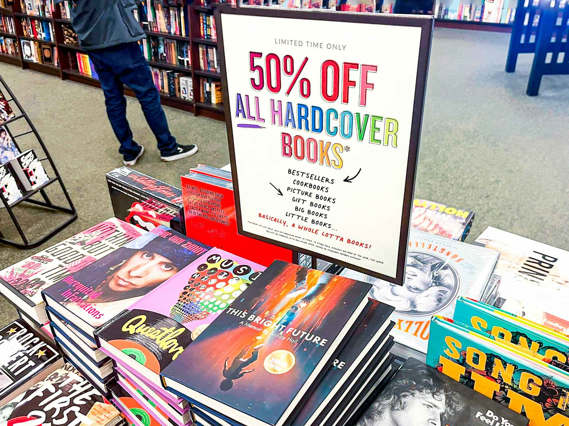 A book display with a sign that reads, "Limited Time Only, 50% off all hardcover books" at Barnes & Noble 