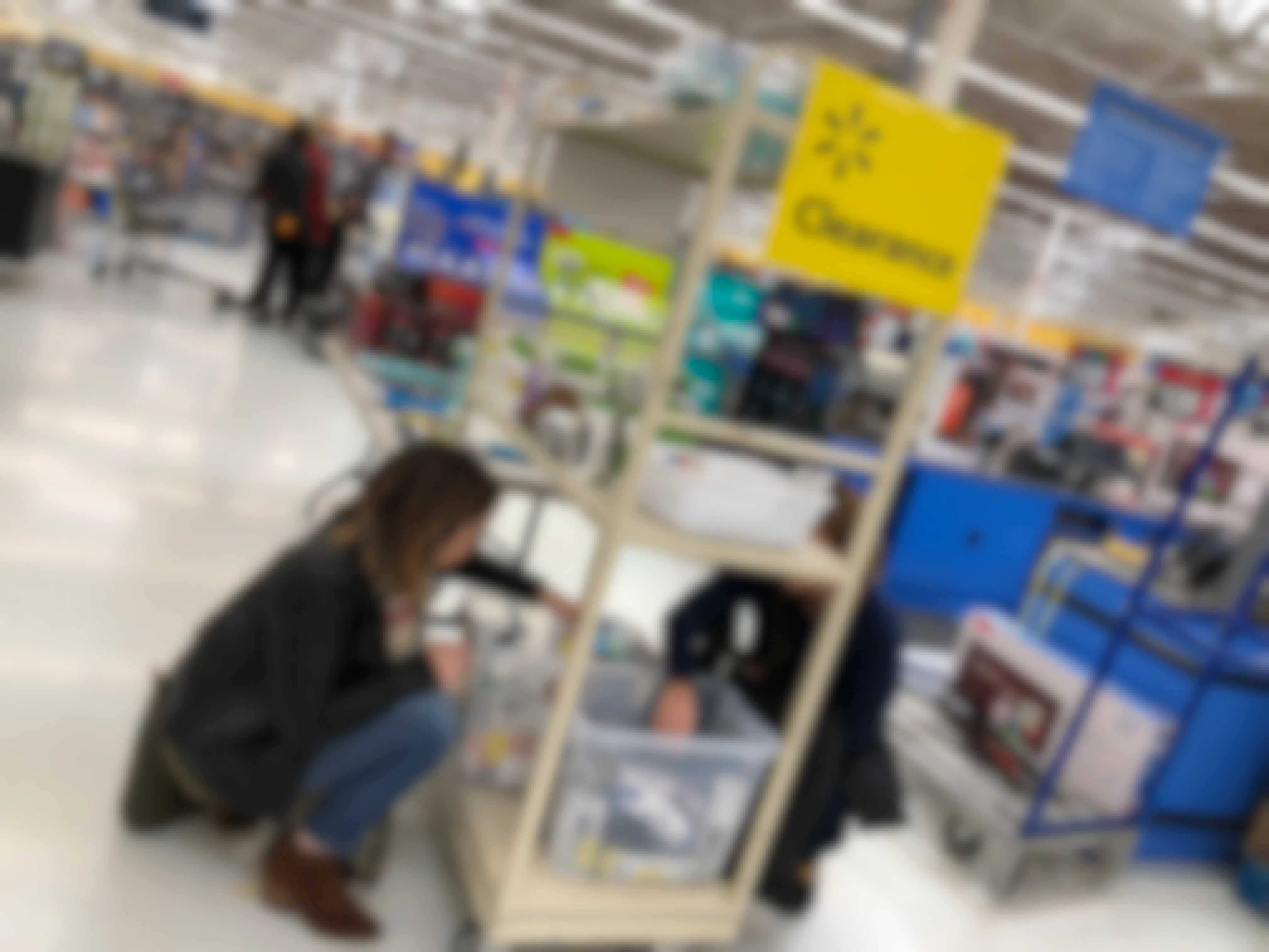 two people looking through walmart clearance