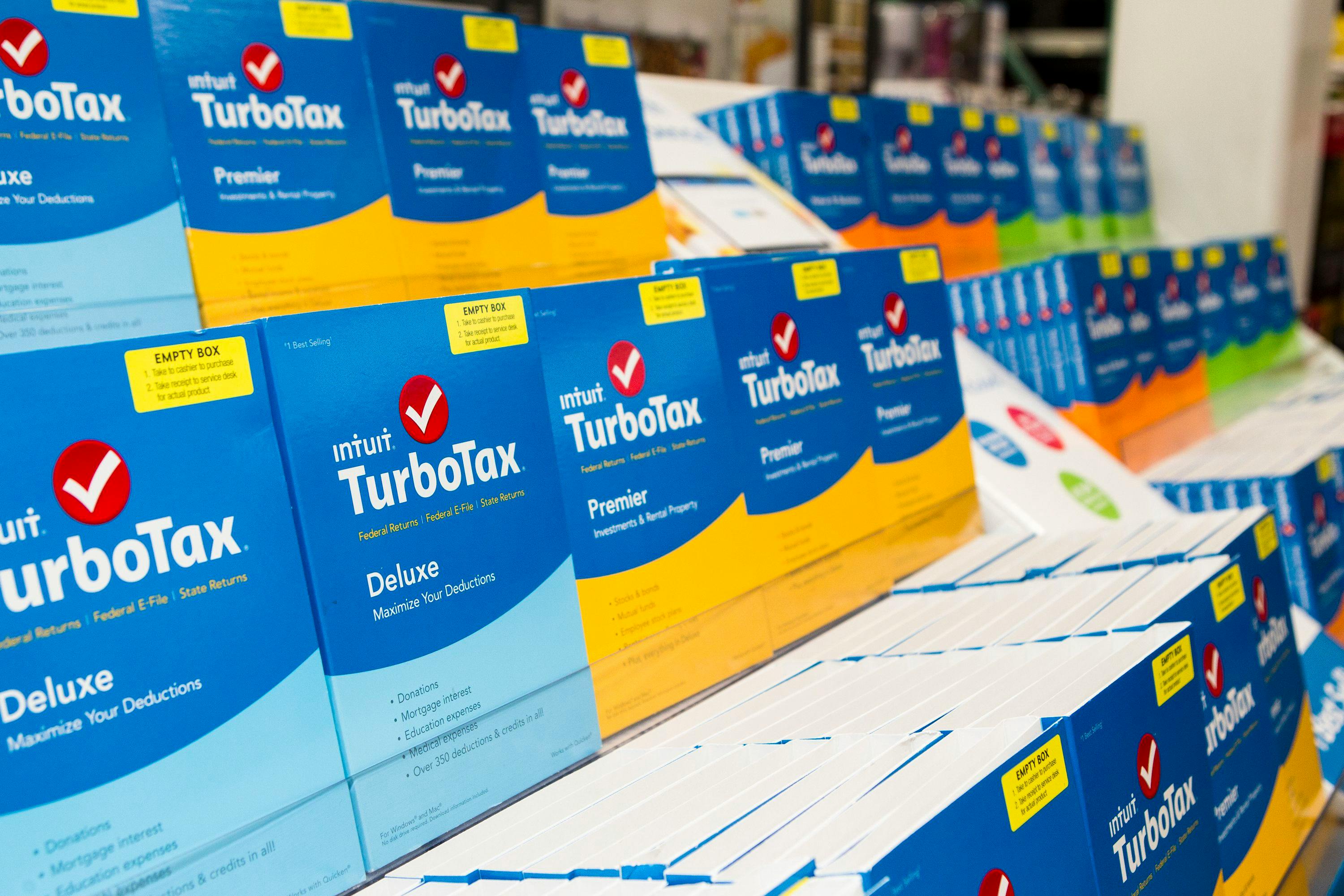 Boxes of TurboTax Deluxe and Premier software on display inside a store.