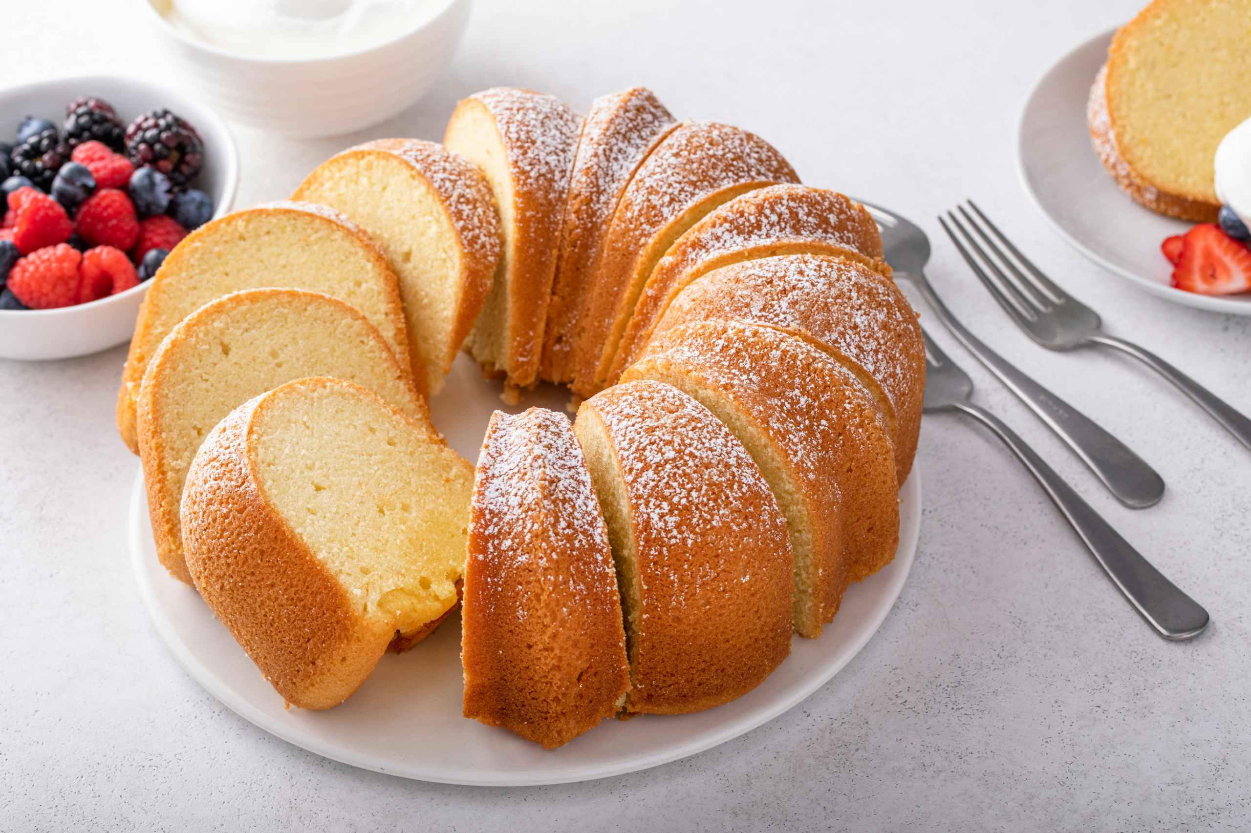 A light and airy champagne pound cake cut up into servings