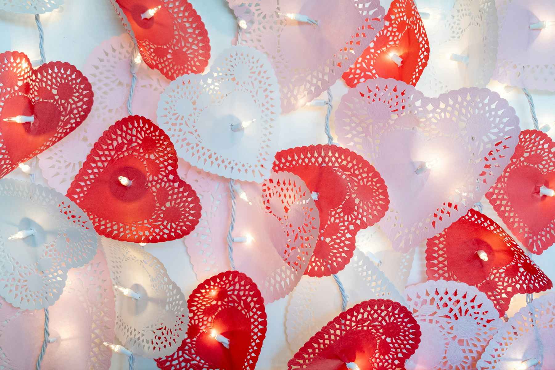 valentines heart doilies with lights in them