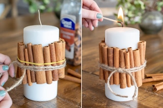 Woman tying twine around cinnamon sticks that are wrapped around a candle.