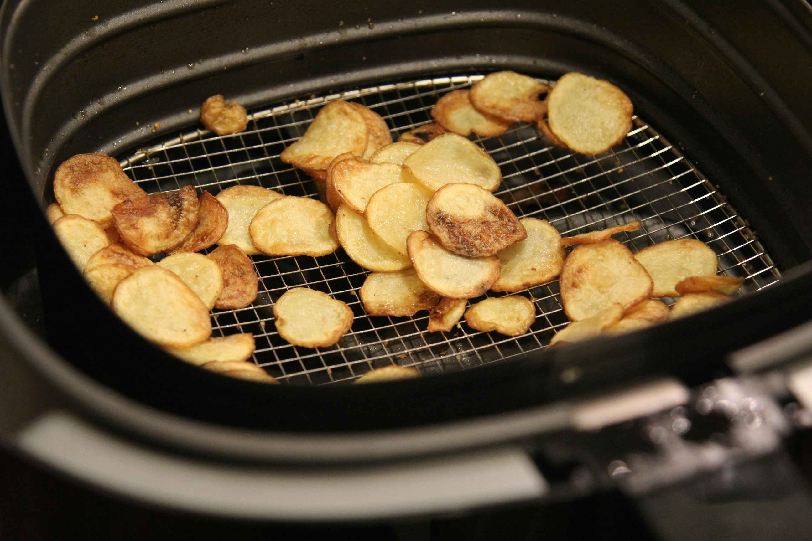 slices of crunchy potato chips in an air fryer