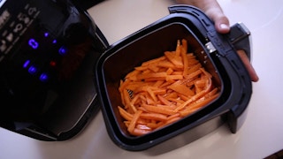 sliced sweet potatoes in an air fryer