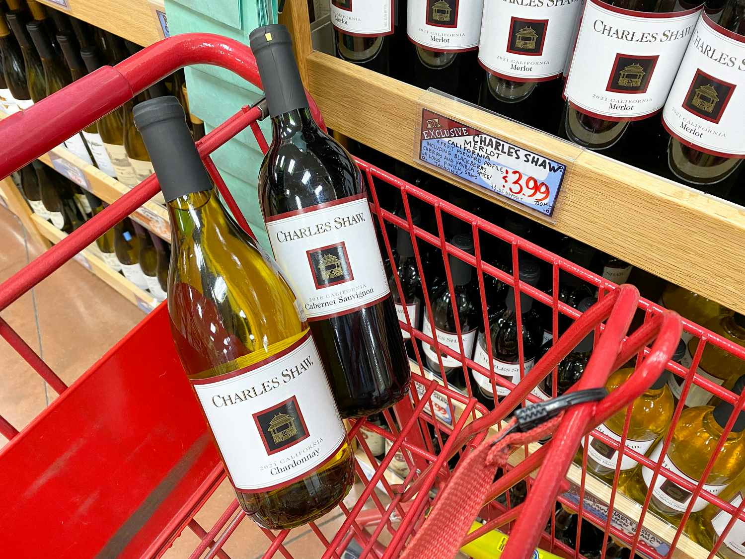 charles shaw two-buck chuck wine bottles in cart