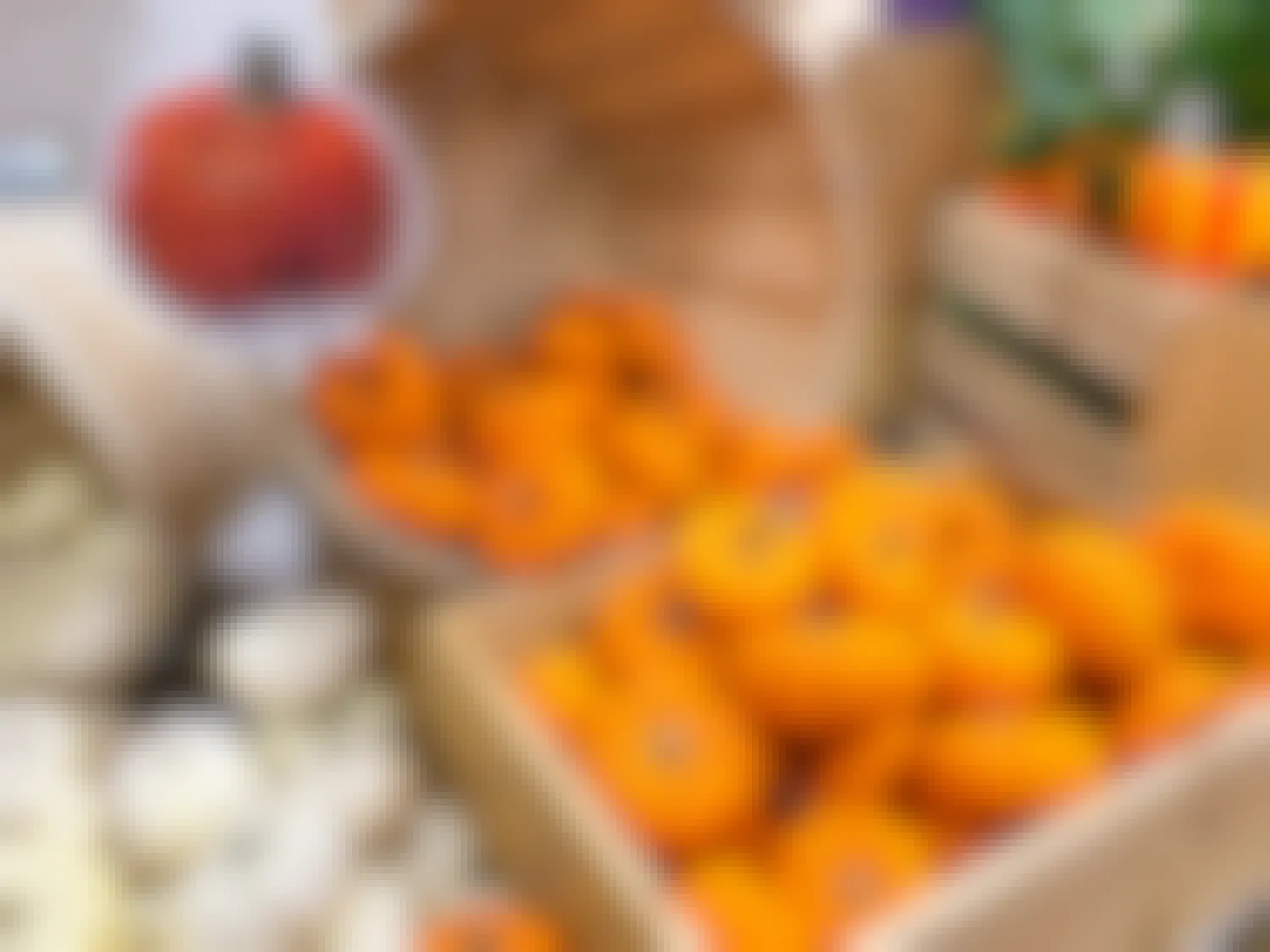 mini orange and white decorative pumpkin display in trader joes