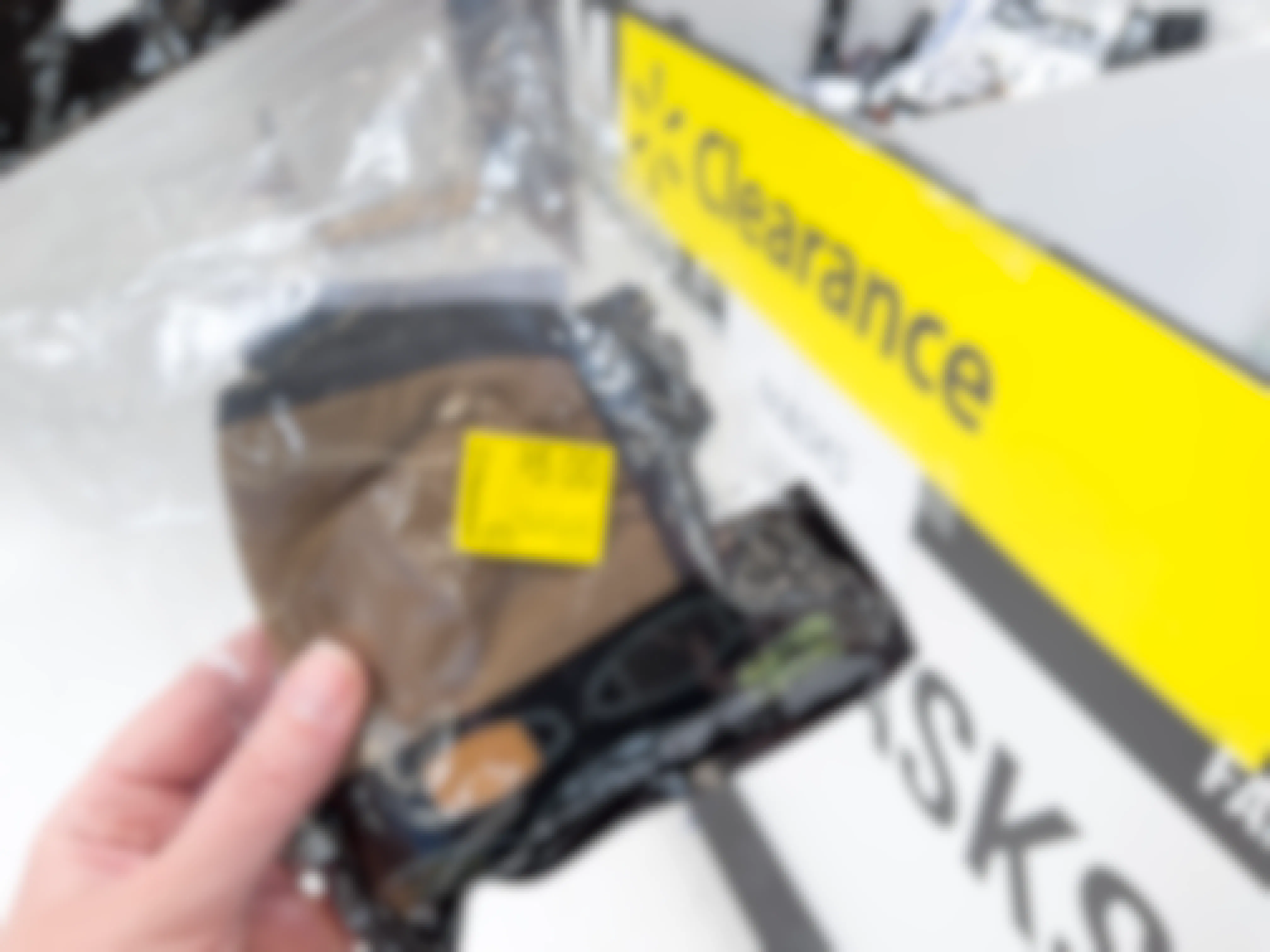 A pack of face coverings with a yellow clearance sticker on them