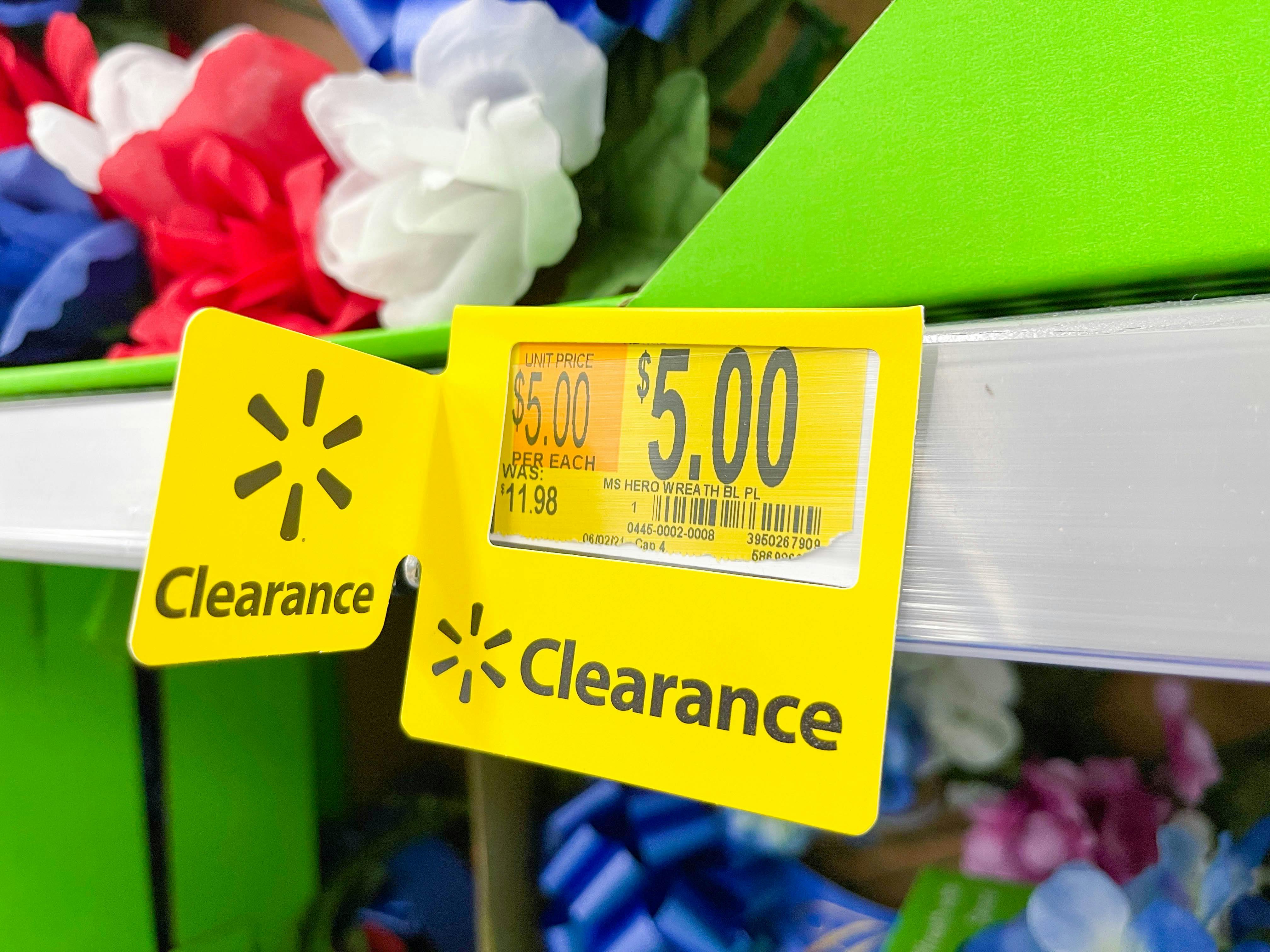 walmart $5 clearance tag on shelf with artificial floral arrangements