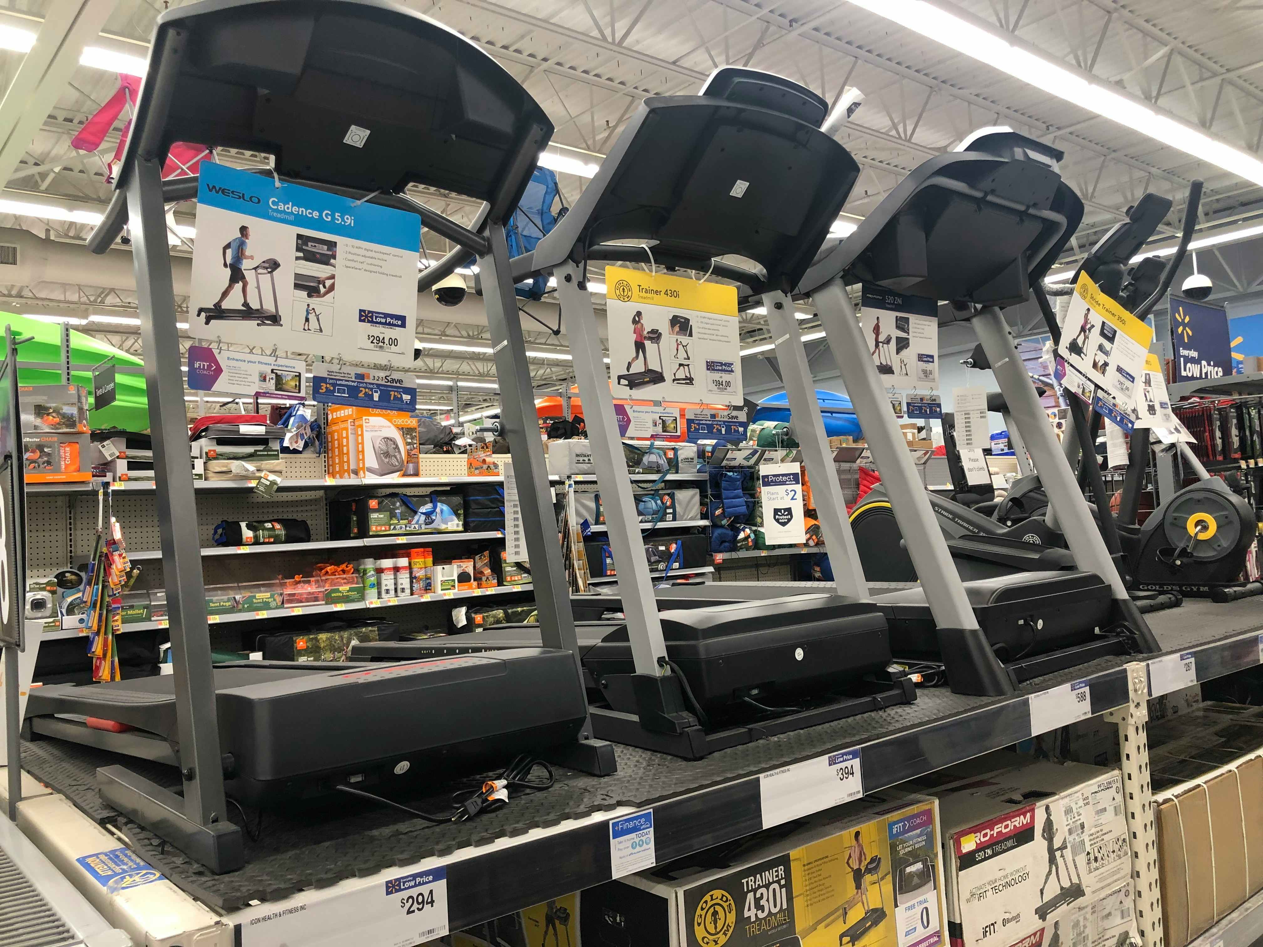 Treadmills on display in a Walmart store