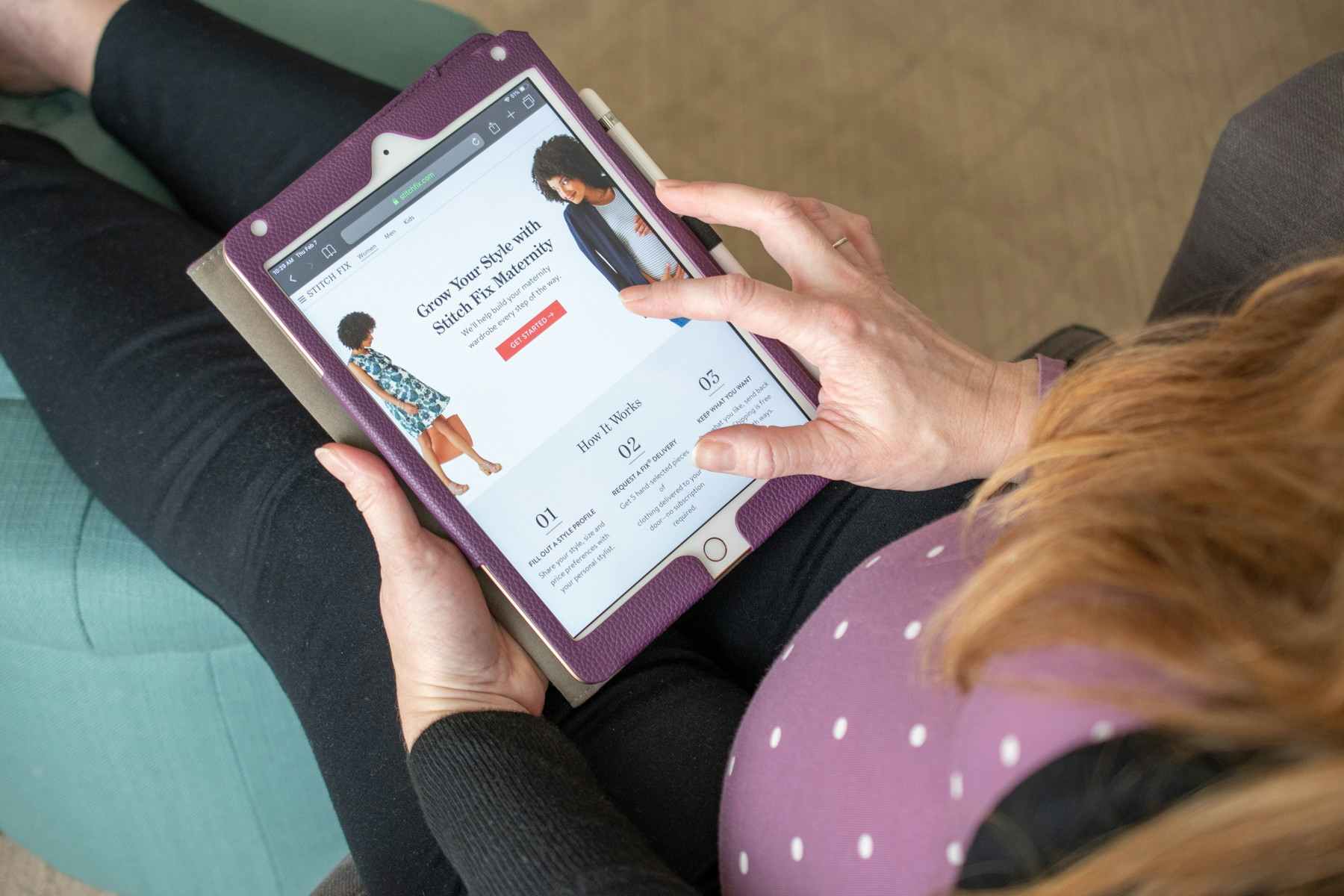 A pregnant woman viewing StitchFix website on a mobile tablet.