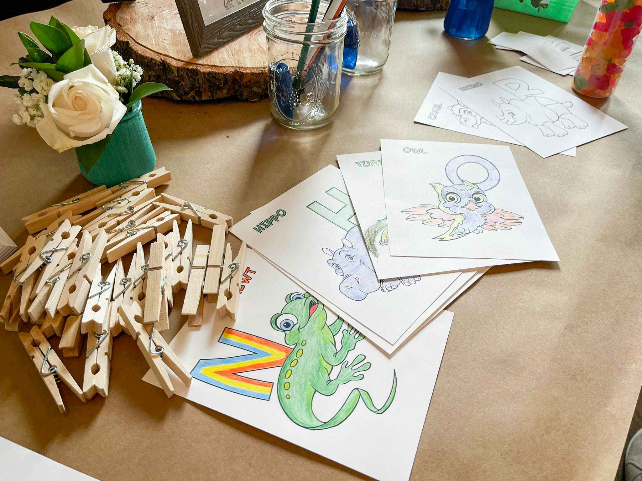 Baby's first abc book coloring pages, colored on a table.