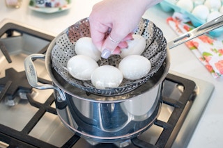 Perfectly cook hard boiled eggs by steaming them.