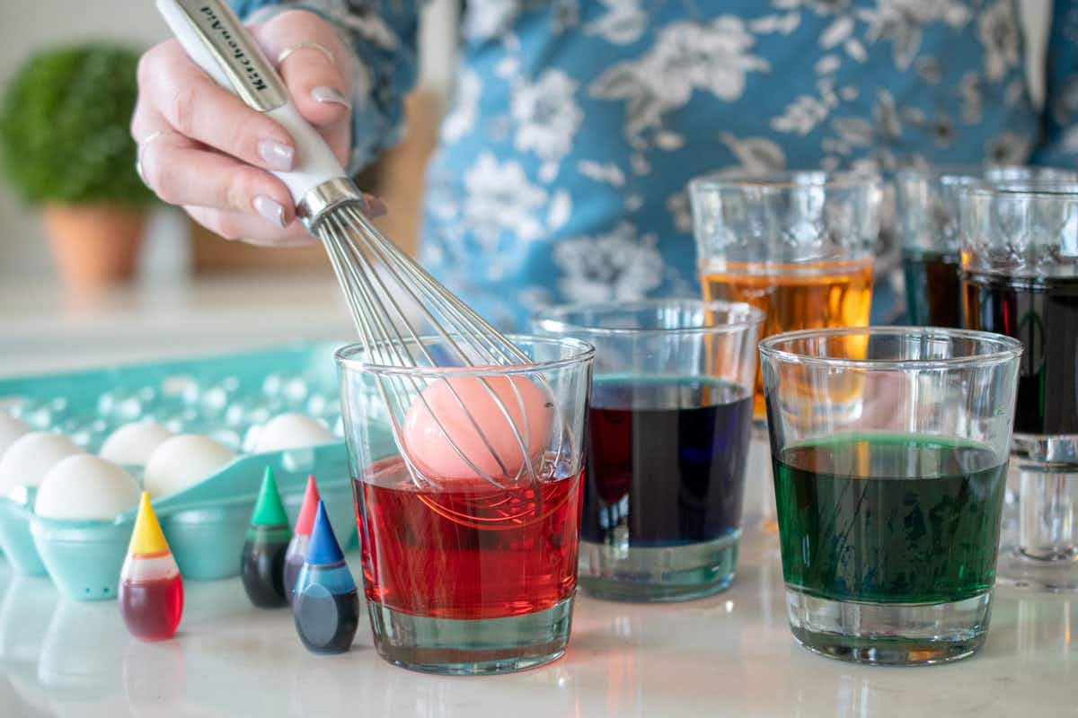 Easily dye eggs with a wire whisk.