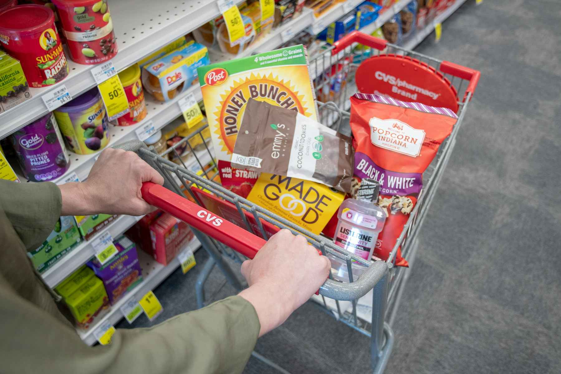a cvs shopping cart filled with grocery items 