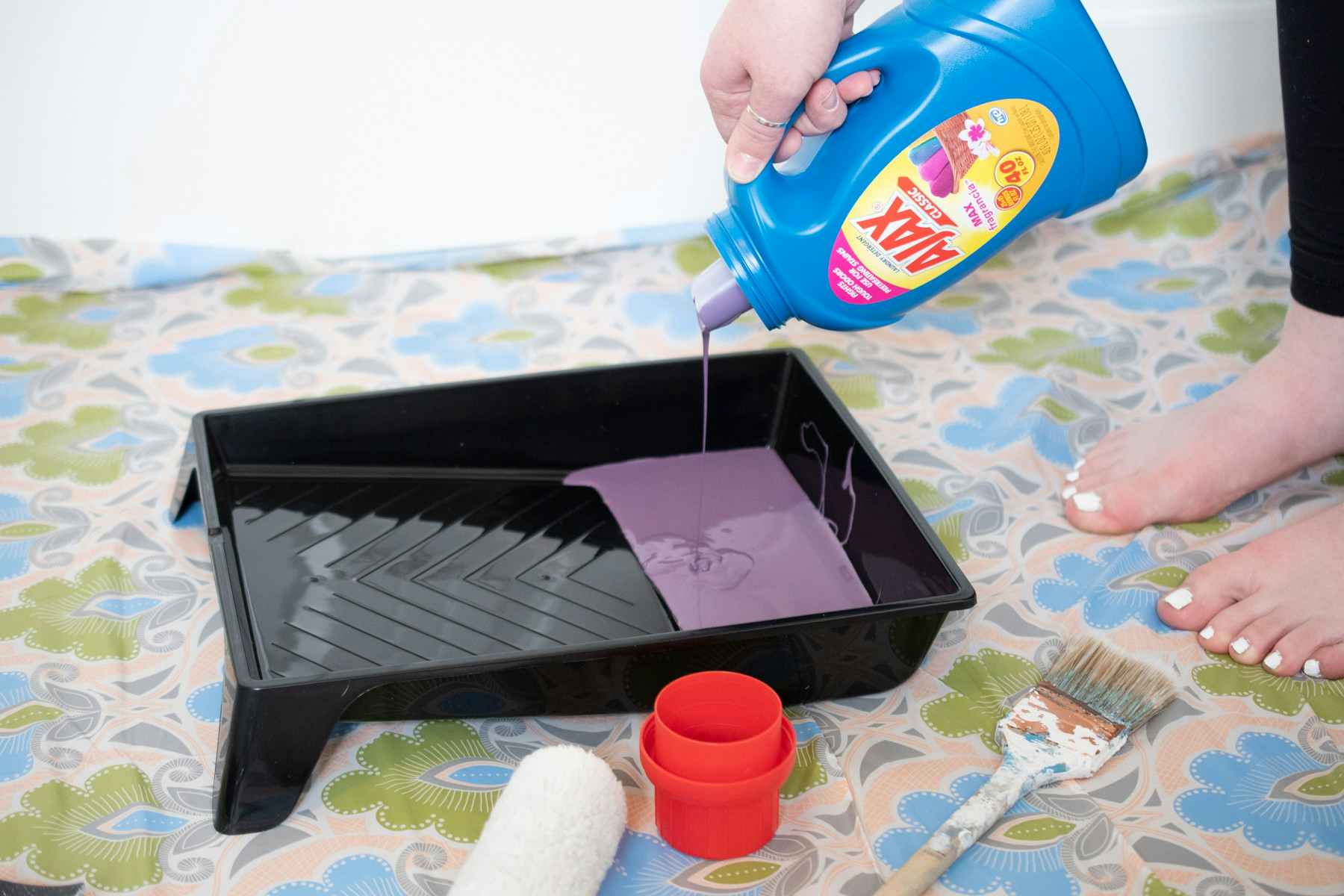 Reuse a laundry detergent bottle to store old paint.