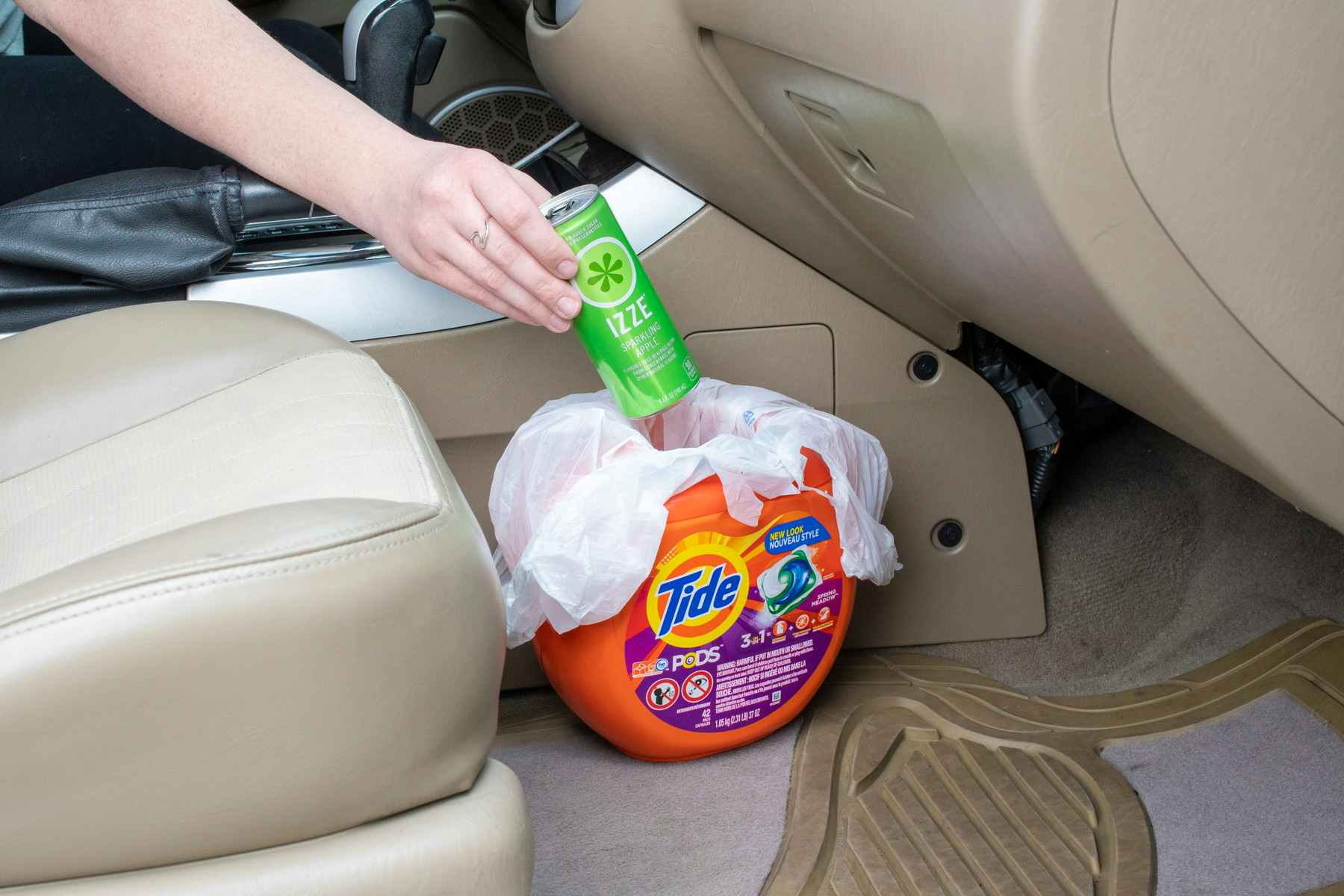Reuse a laundry detergent bottle for a car trash can.