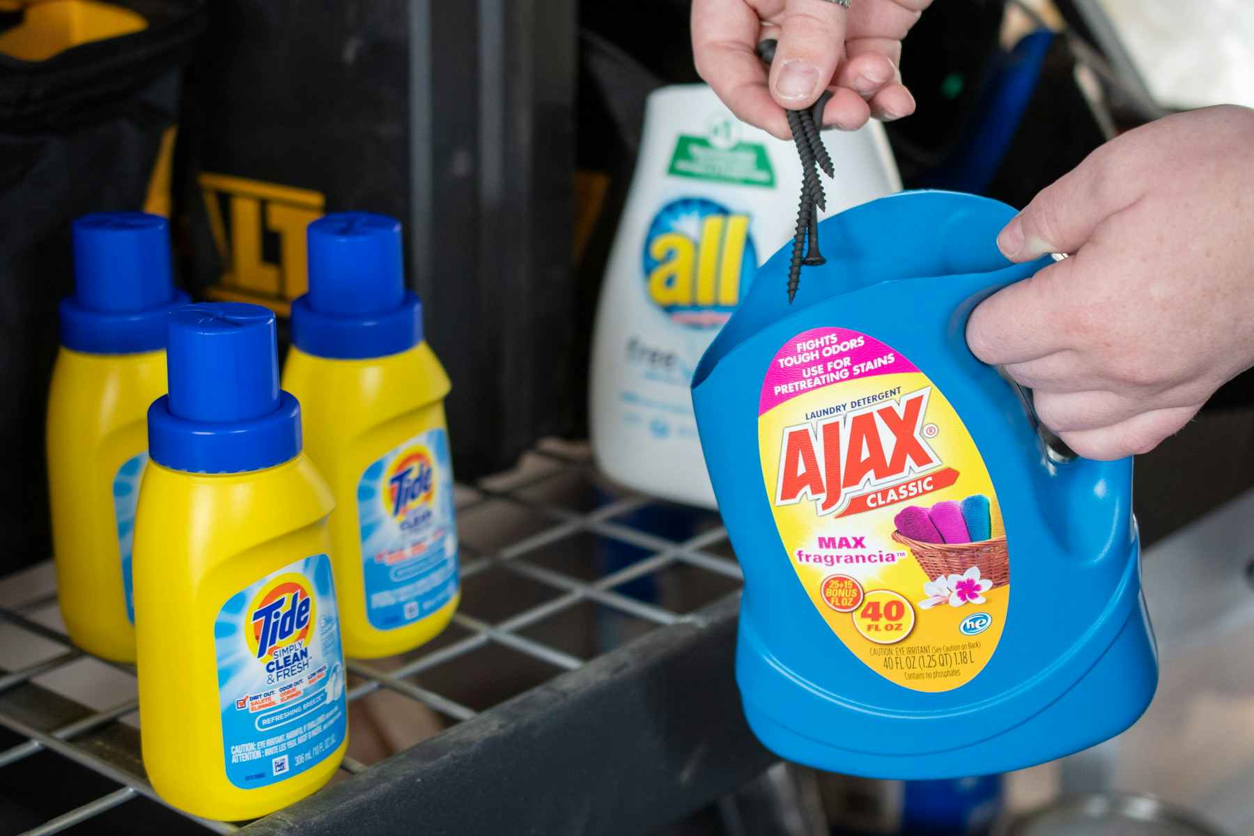 Reuse a laundry detergent bottle for tool shed storage.