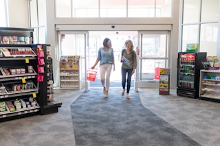 two women walking into cvs