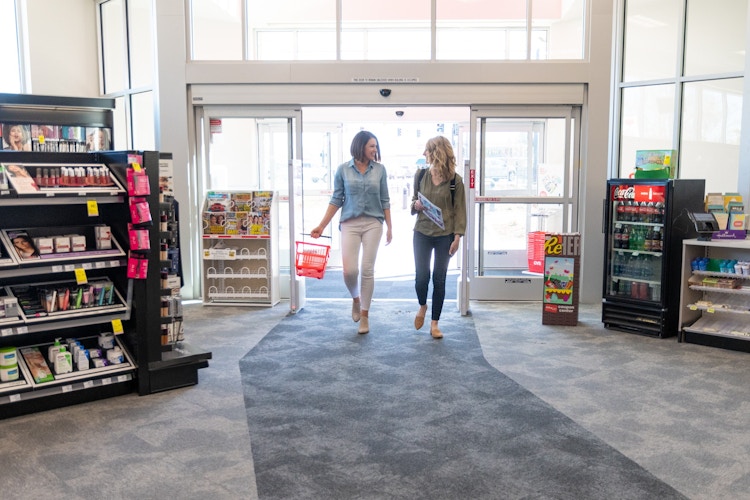 two women walking into cvs