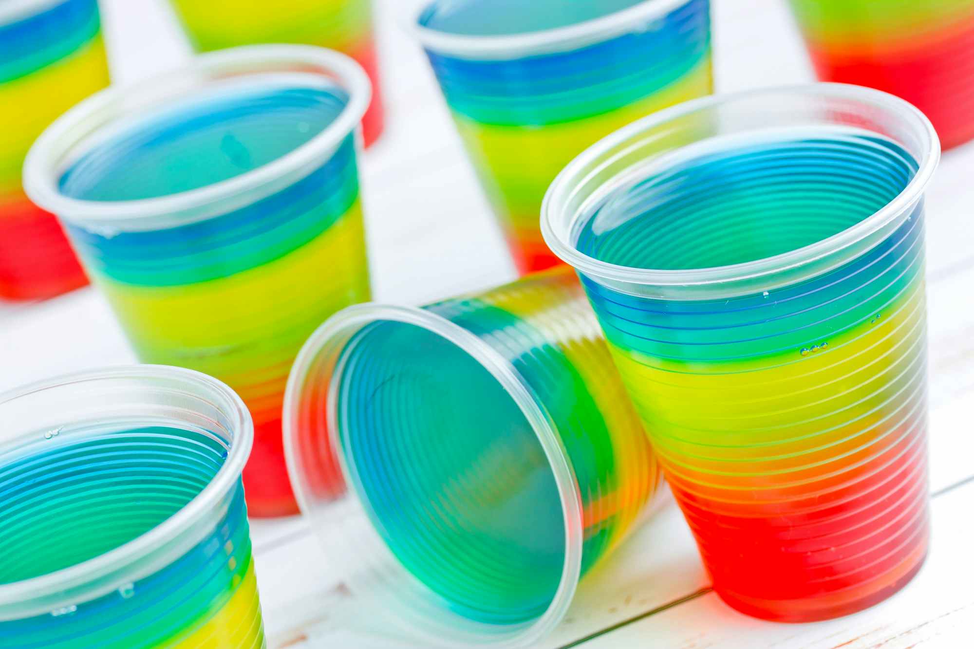 Cups with a rainbow of colorful Jell-O in them