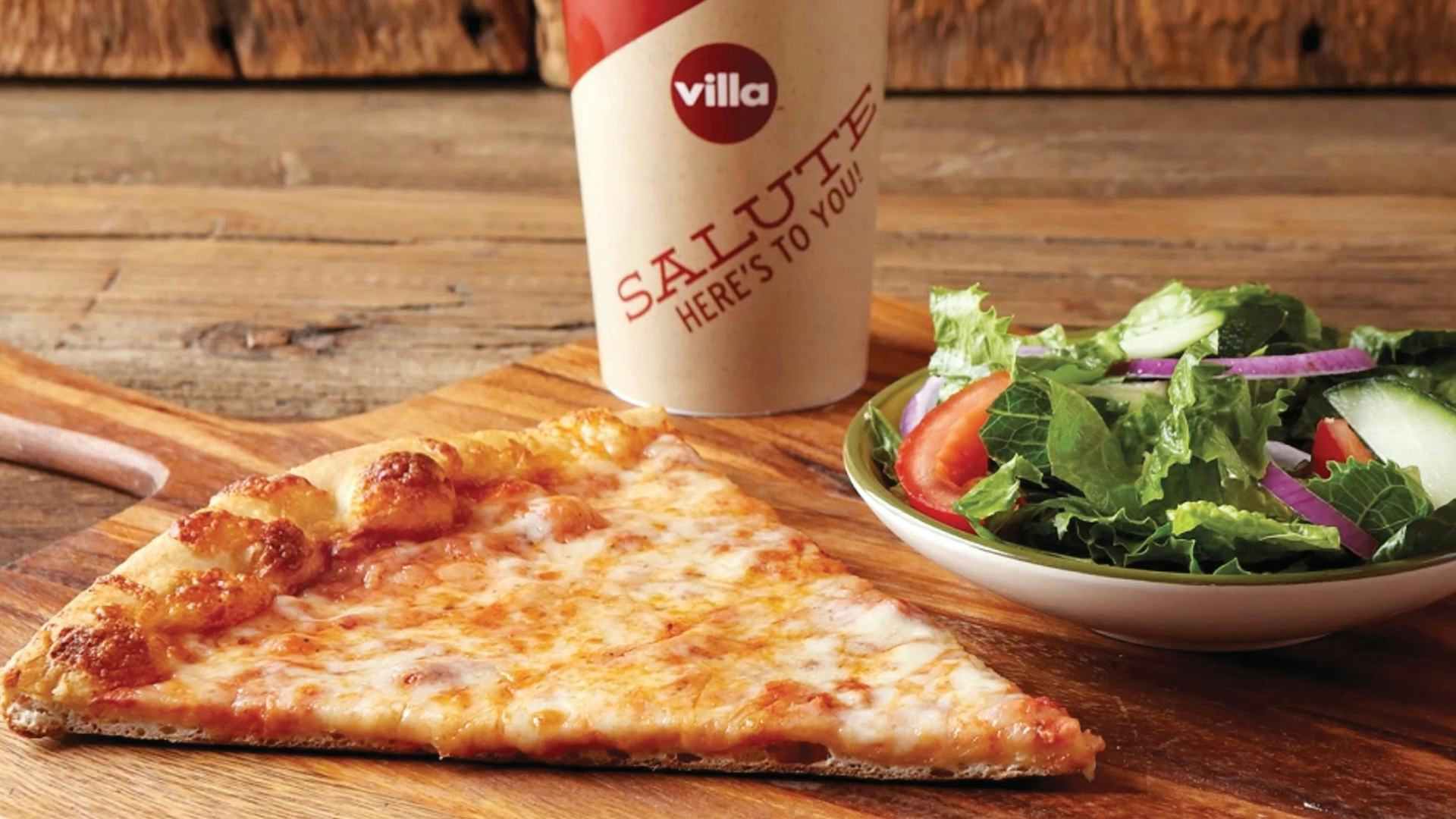 A slice of pizza, salad, and soft drink from Villa Italian Kitchen