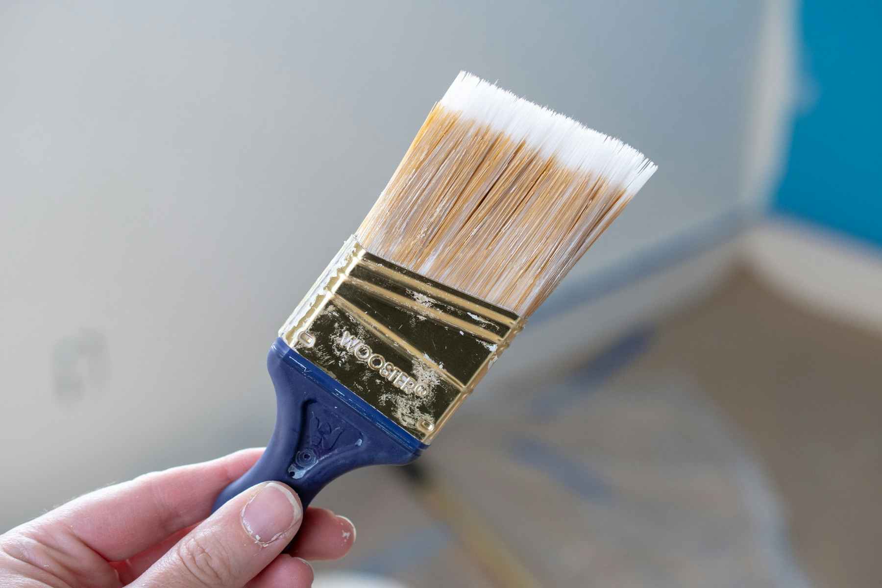 someone holding paintbrush