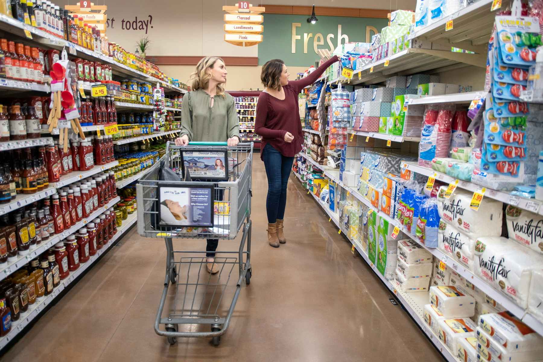 Two women grocery shopping.