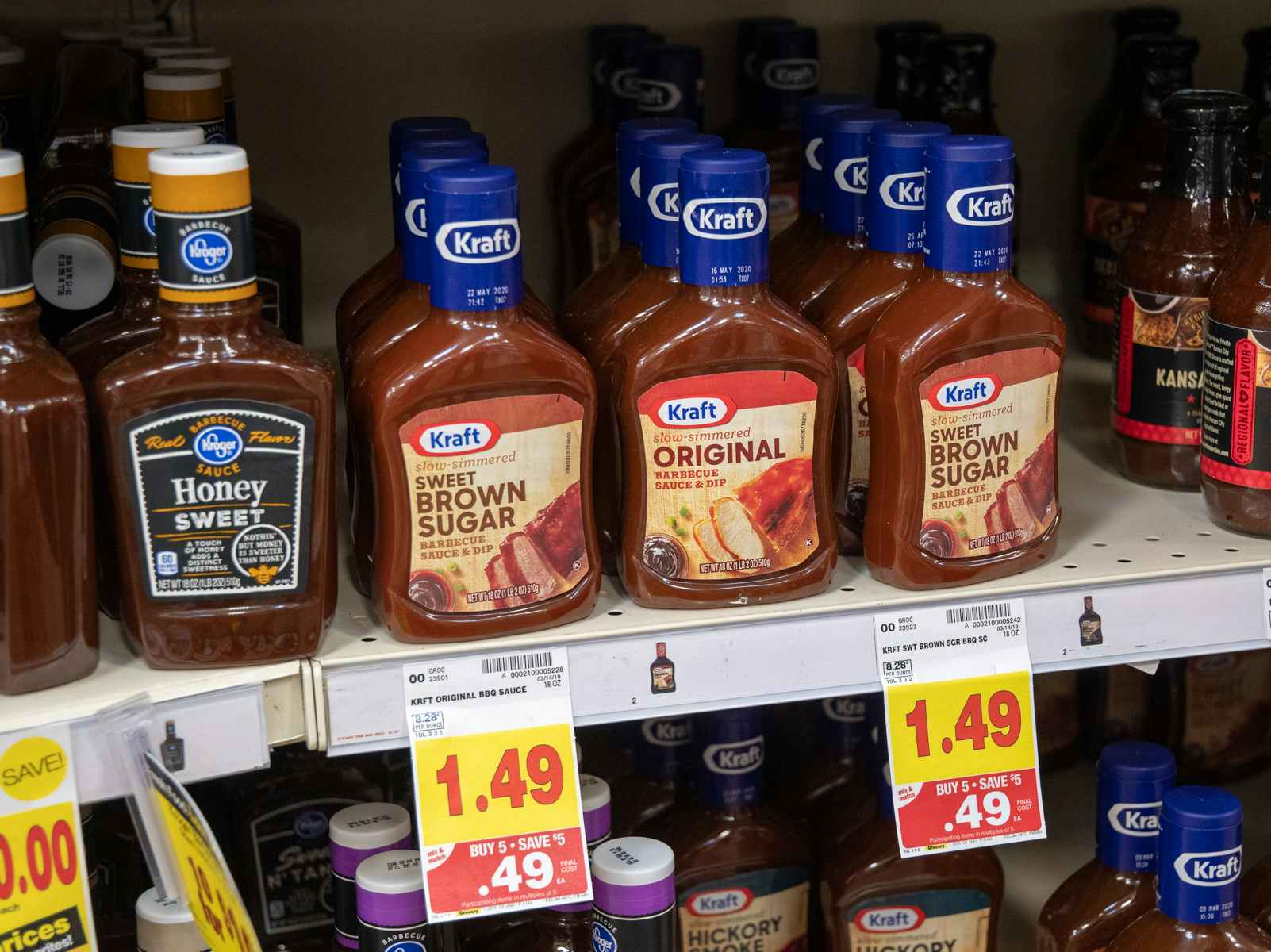 Bottles of barbeque sauce on a store shelf.