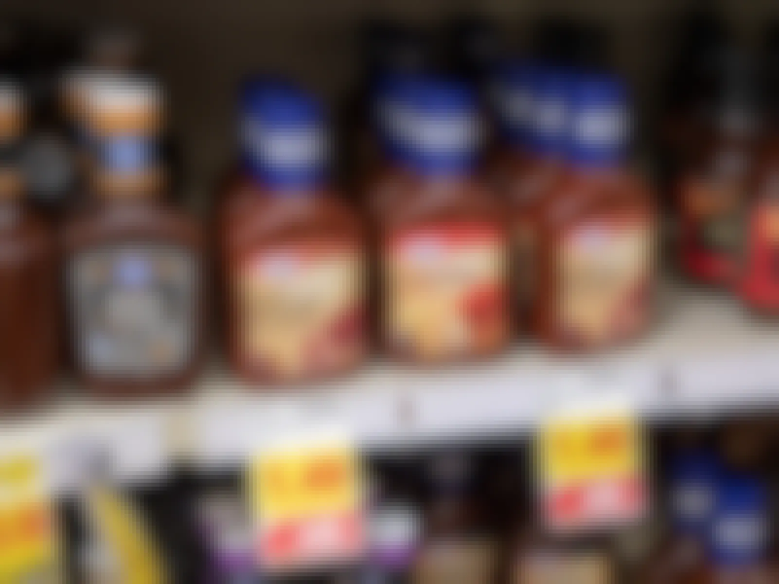 Bottles of barbeque sauce on a store shelf.