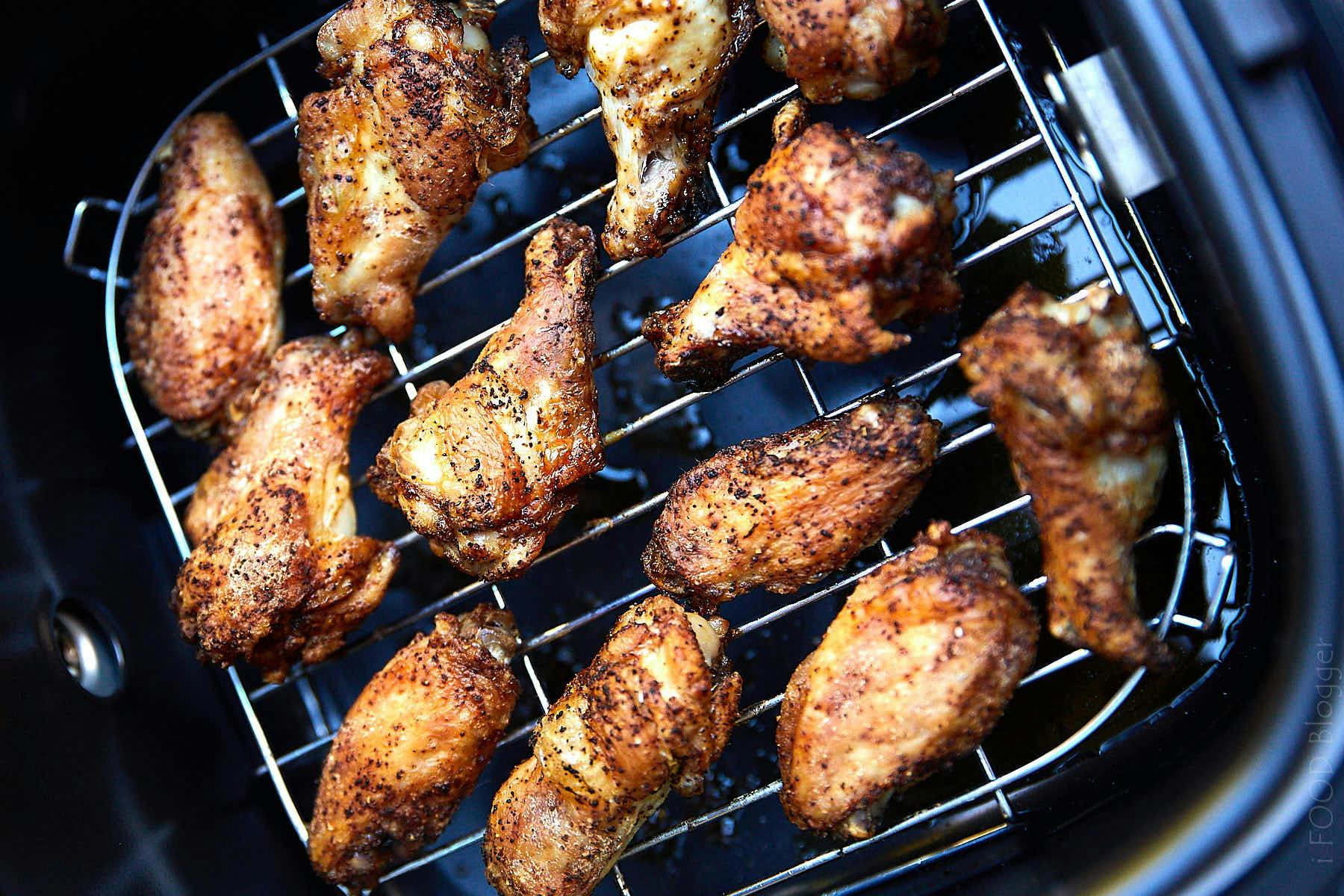 Chicken wings on a rack in an air fryer