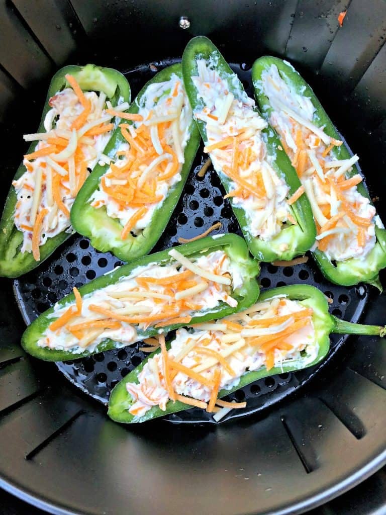 Cream cheese stuffed jalapeno peppers in an air fryer.
