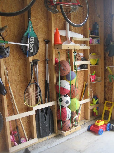bungee cords and woods slats holding balls
