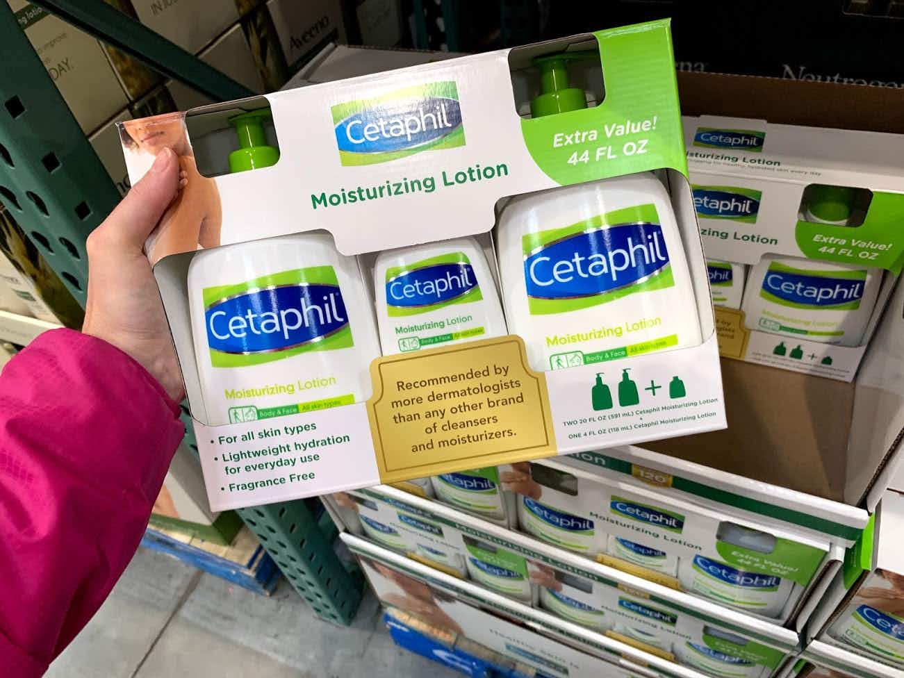 cetaphil lotion package being held in store 