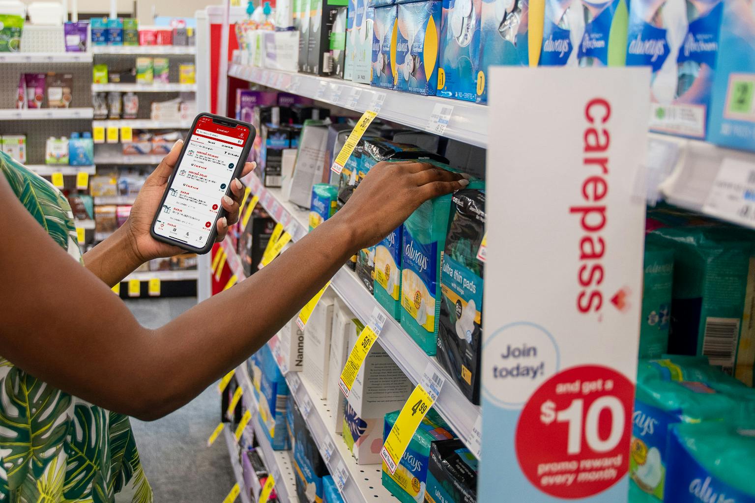A woman shopping in CVS with the CVS app