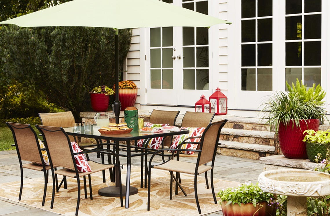 garden treasures pelham bay stackable steel dining chair with tan sling seat