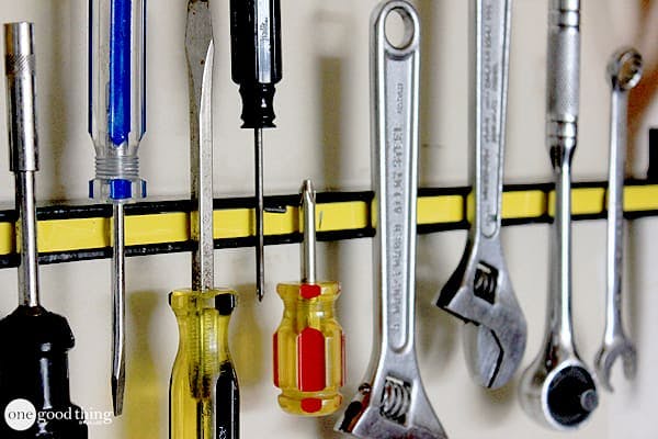 tools hanging from magnetic strip