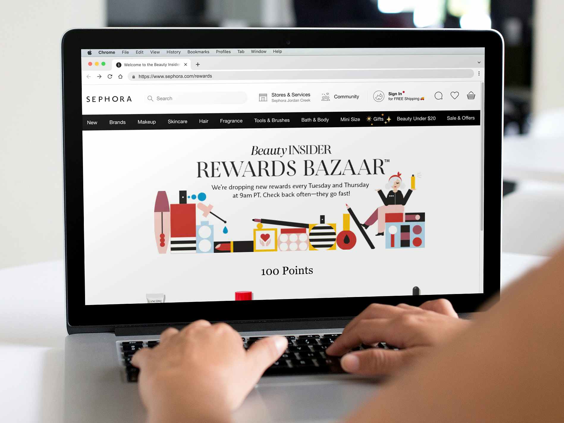 person on laptop looking at sephora beauty insider rewards bazaar page