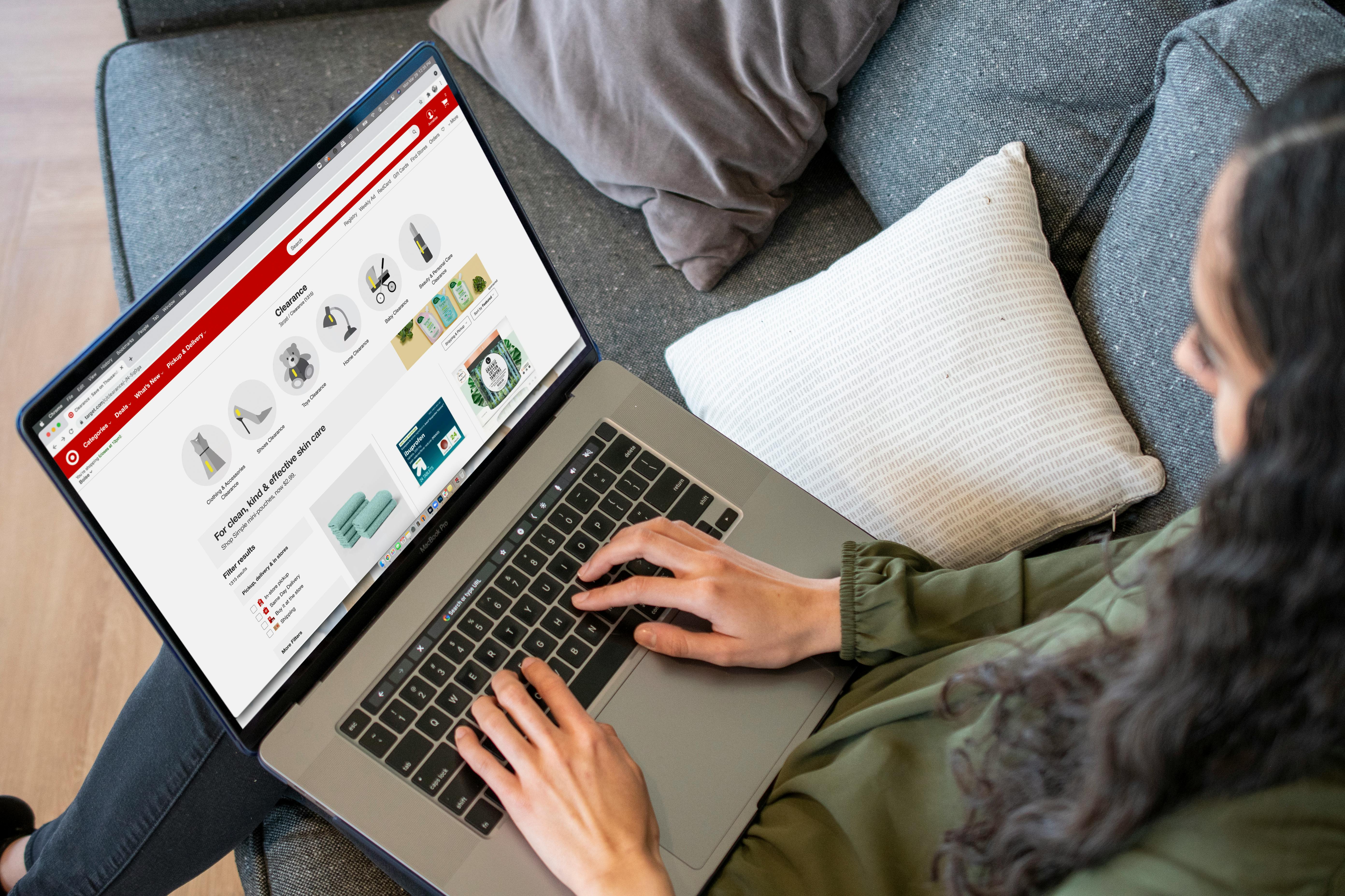 person on laptop browsing target categories at home