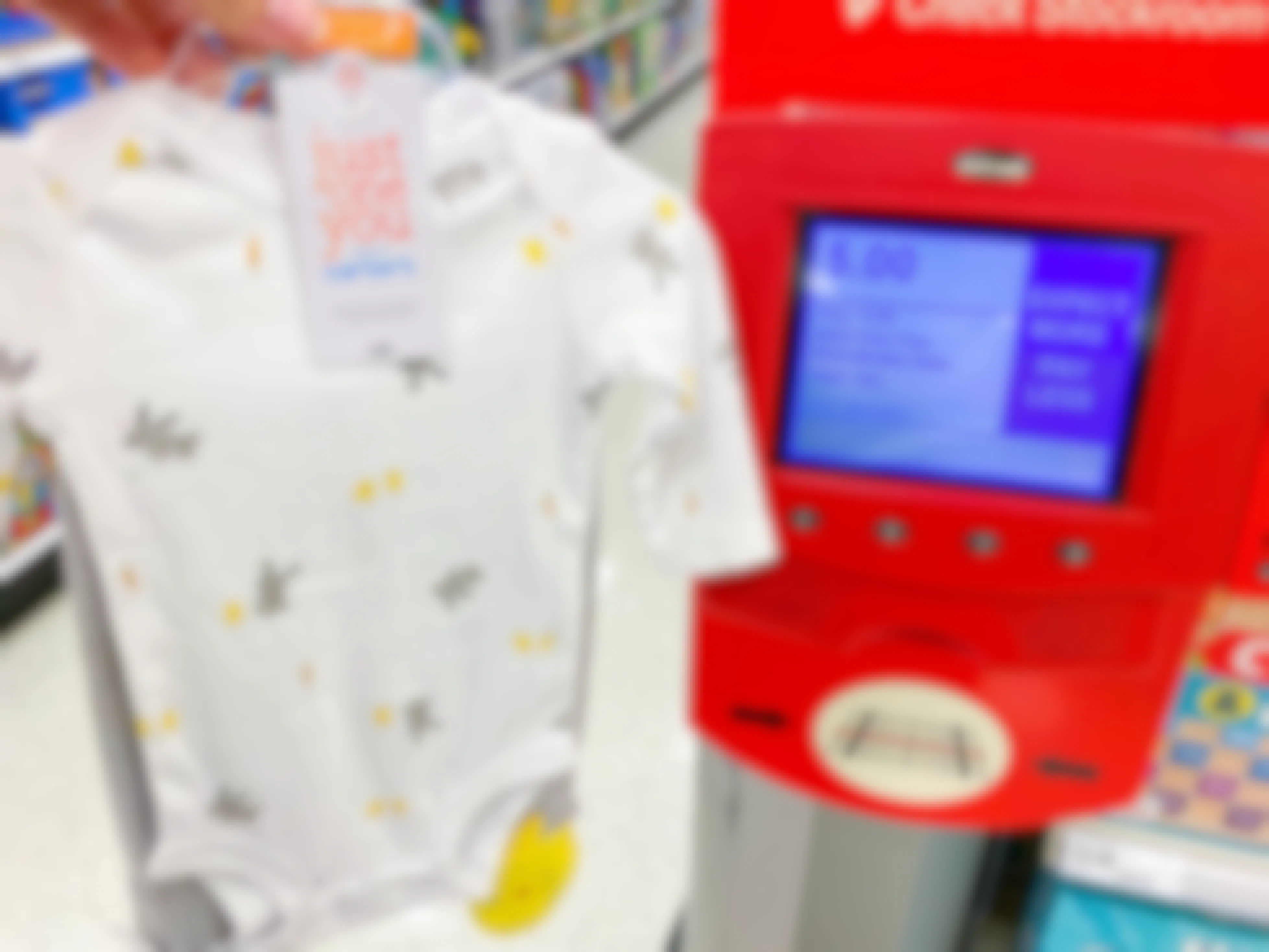 baby clothes being held in front of target scanner showing sales price