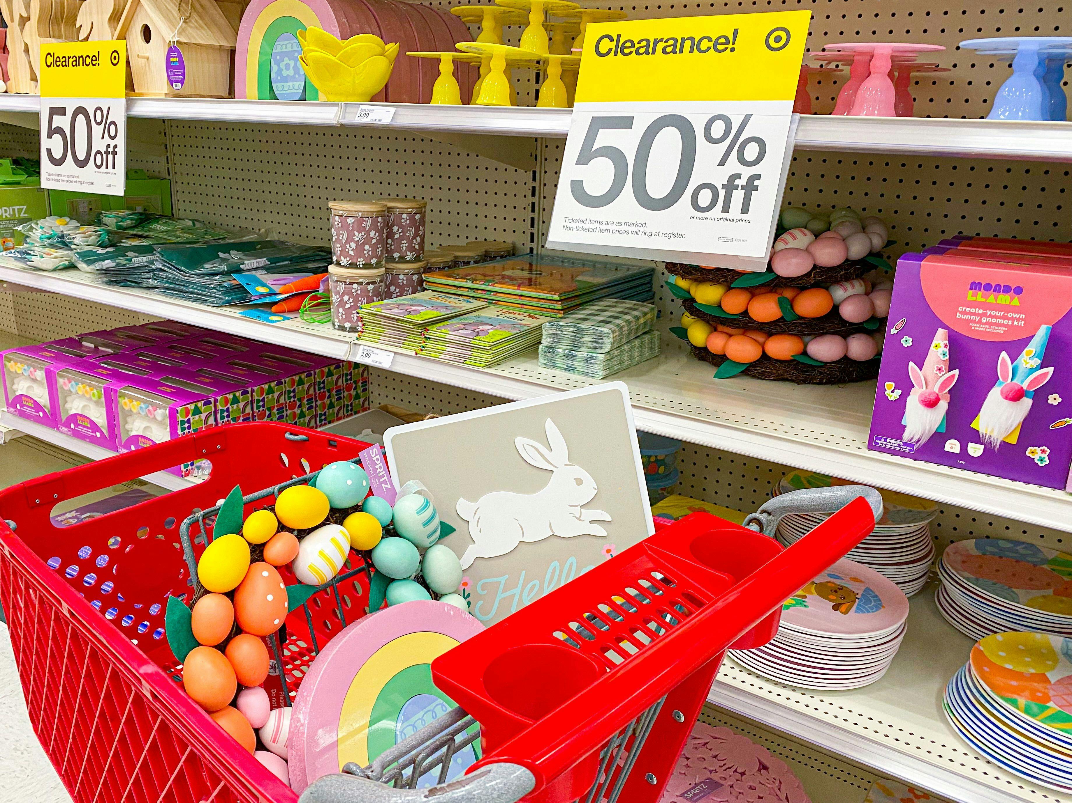 a target cart top basket filled with clearance easter items in front of clearance sign