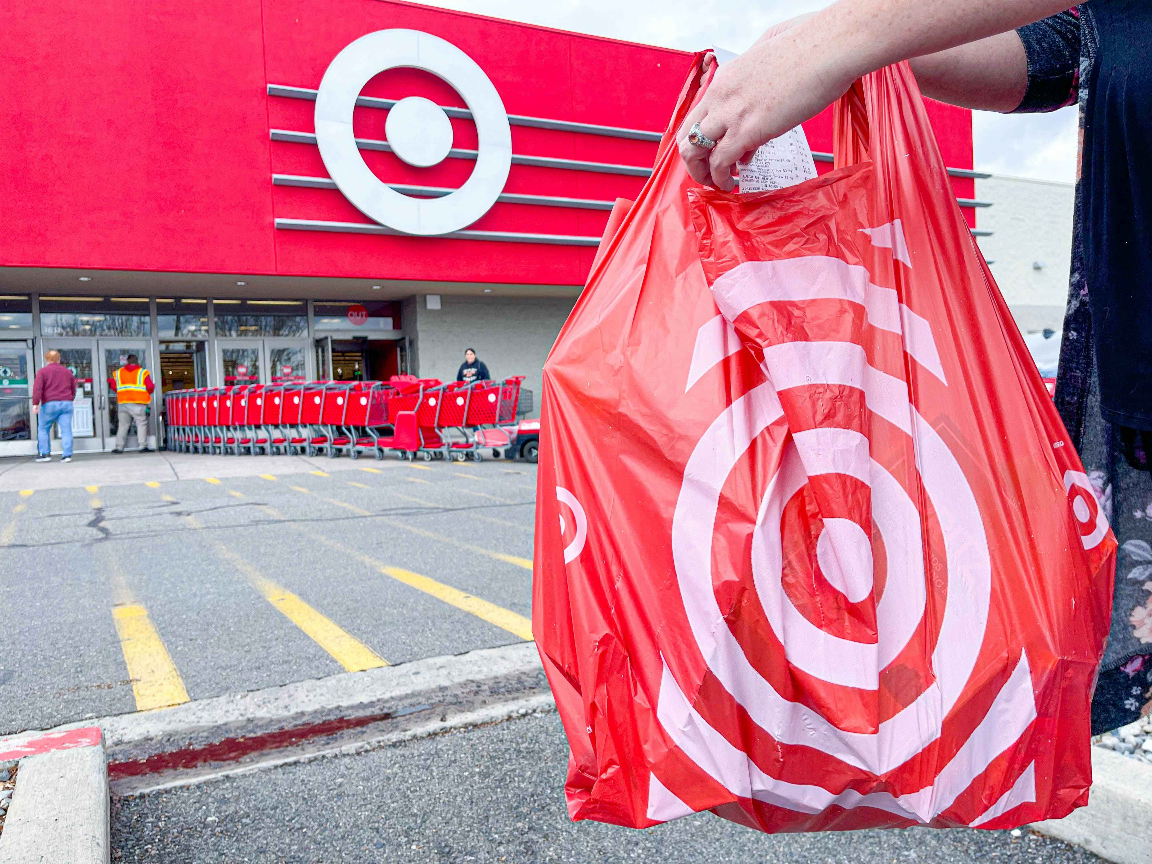 a target bag and receipt being held outside of target store