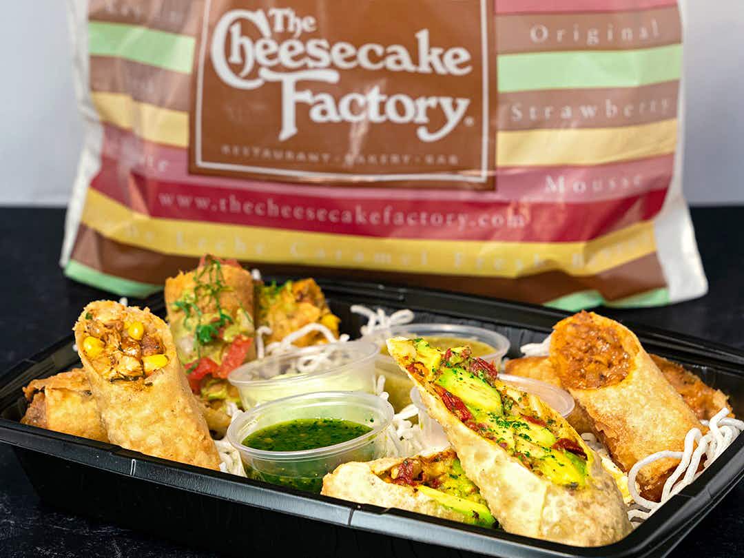 the cheesecake factory avocado egg rolls and carry-out bag