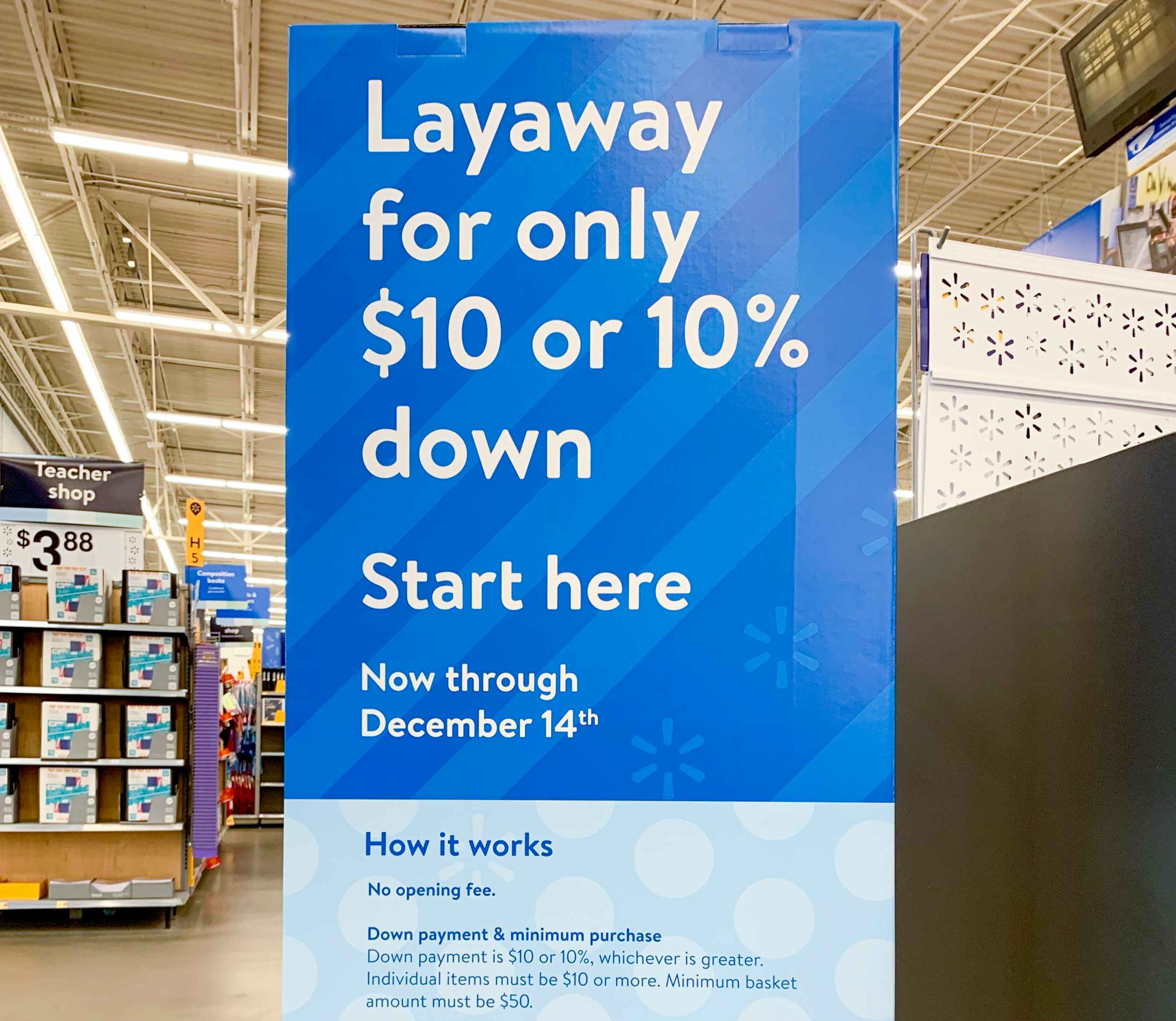 A sign advertising Walmart layaway inside a Walmart.