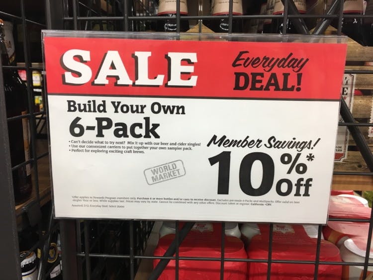 A World Market everyday deal sale sign that reads, "Build your own 6-pack